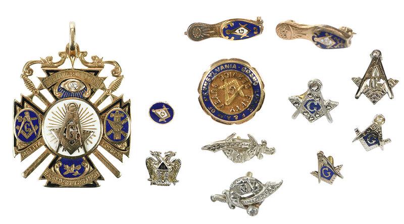 Large Group of Masonic Pins and Pendant: pendant, one old cut diamond, blue, white and black enamel, stamped "14K", yellow gold, 1-9/16 x 1-1/16 in., 15.8 grams; six pins stamped or tested 14kt., white and yellow gold, 5/16 x 1/4 to 5/8 x 1/