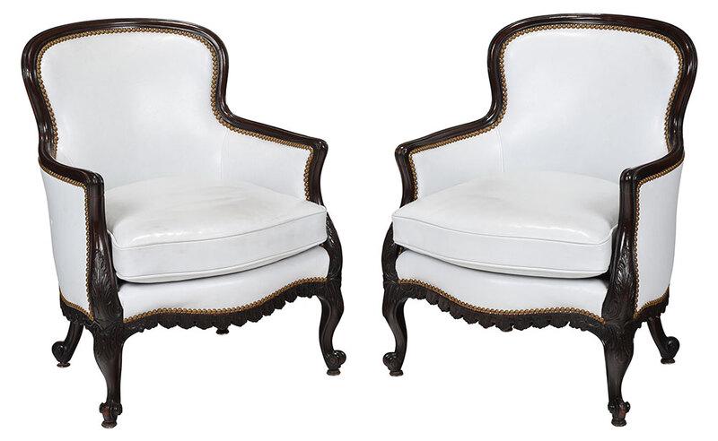 Pair Chippendale Style Mahogany Club Chairs: 19th/20th century, carved mahogany frames with leaf carved knees and scrolled feet, pale blue leather upholstery with loose seat cushions, 31-1/2 x 24 x 20 in. - Provenance: Private Collection Ashevil