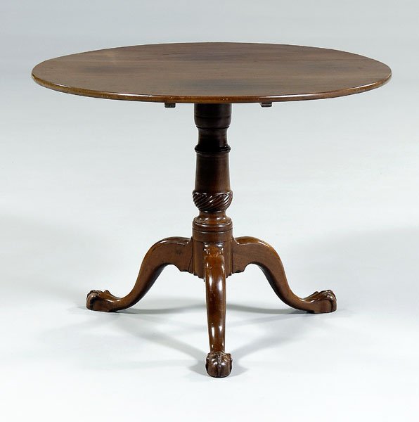 Chippendale tilt-top tea table,: figured mahogany top, spiral-turned support on tripod base with ball-and-claw feet, British, 18th century, 26-3/4 x 34-7/8 x 34-1/2 in. Refinished, battens replaced, patches and repairs to block suppo