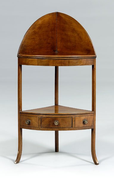 Hepplewhite inlaid corner wash stand,: mahogany, dovetailed arched backsplash, lower shelf over dovetailed drawer, British, early 19th century, 43 x 24-1/2 x 16 in. Refinished, wash stand openings now covered with mahogany top, some breaks