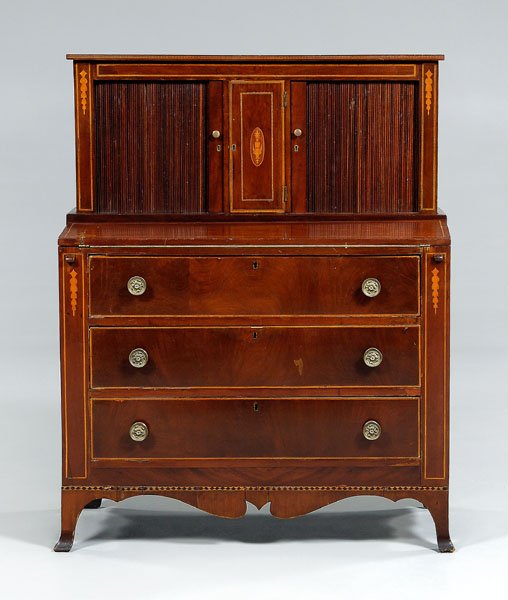 Federal style inlaid tambour desk,: mahogany, upper section with urn-inlaid prospect door flanked by tambour doors opening to fitted interior, desk with fold-down writing flap over three long dovetailed drawers, French feet, American, p