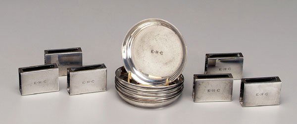12 pieces Tiffany sterling: six round coasters, 1907-1947, "21867...9812", 2-7/8 in.; six matchbox covers, no date mark, 1-5/8 x 1-1/8 in., monogrammed "E.H.C", 13.86 oz.T., all with original bags. All with light scratches.