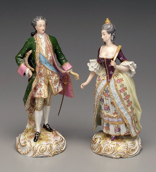 Pair porcelain figures:: man with sword and woman with fan, 18th century attire, bases marked on back with blue-printed crossed swords mark, possibly Bloch (French) or Kalk (German), late 19th/early 20th century, each 13-1/8 