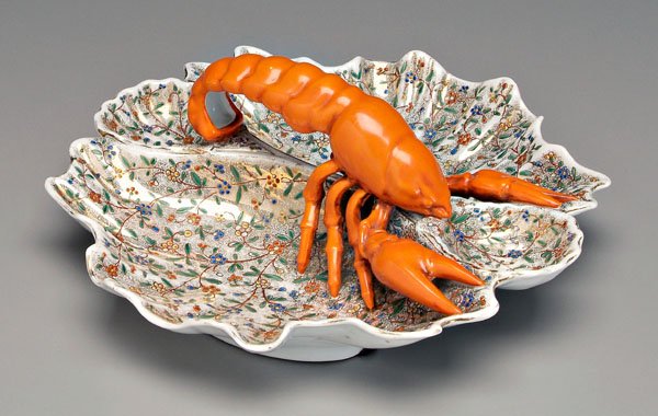 Porcelain lobster dish,: shell form with scalloped edge, interior with enameled floral decoration, impressed on base "F&M", possibly Fischer & Mieg, blue beehive painted over glaze, 4-3/4 x 12 in. Minor cracks and scratches t