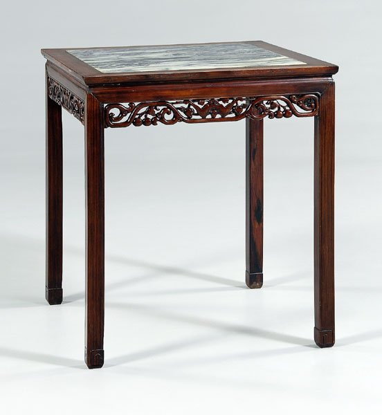 Chinese hardwood square table,: inset dreamstone top, skirt carved with bats, peaches, scrolling vines, 19th or 20th century, 33-1/4 x 29-1/2 x 29-1/2 in. Separations, repairs to skirt, later glue at joints, stone with scratches.