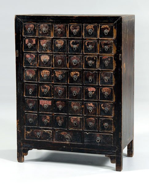 Chinese apothecary cabinet,: 42 drawers with divided interiors over three drawers, metal pulls, mortise-and-tenon construction, lacquered surface, old paper labels on drawer fronts, export seal on back, 20th century, 46 x 33-1/2 