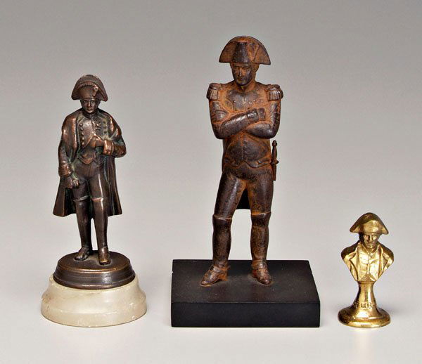 Three sculptures of Napoleon: full portrait, in uniform, iron, 7 in., [loss to surface, rust;] full portrait, in uniform, bronze on alabaster base, 5-7/8 in., [loose on base, base with scratches, wear to patination;] portrait bust
