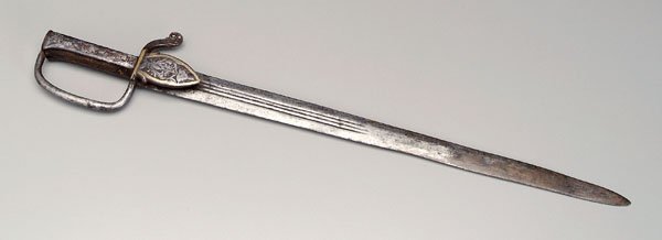 Bayonet or short sword,: guard with petal-shaped engraved and gilt decoration, grip with deep scrolls, 25-1/2 in. Blade with scattered rust, some old cleaning with bright metal.