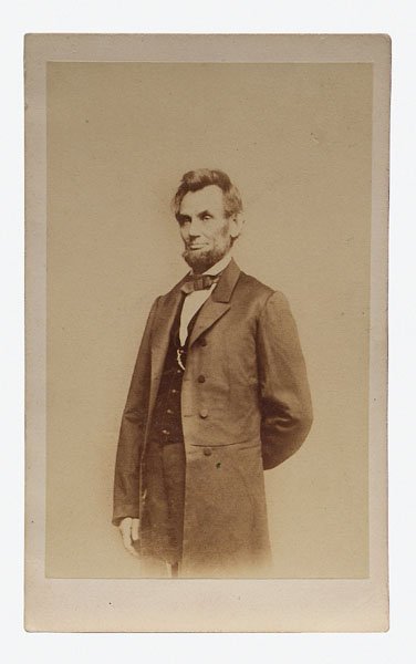 Abraham Lincoln [carte de visite,]: "Solitary Pine" pose by Matthew Brady, taken January 8th, 1864, "Brady's National Photographic Portrait Galleries" imprint verso, 1860s, 4 x 2-3/8 in. Fading, toning, light soiling. Provenance: Privat