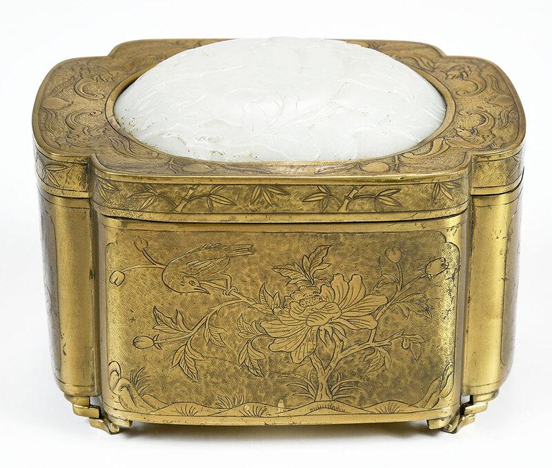 Chinese Brass Box with Carved Jade Plaque: probably Qing dynasty, engraved brass box decorated with flowers and birds on sides and bats on top, cover mounted with circular white "mutton fat" jade plaque with carved bat and peach design, to top