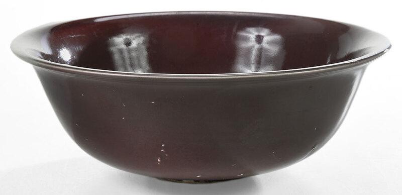 Chinese Glazed Sang de Boeuf Porcelain Bowl: underglaze blue character mark, possibly˜Tongzhi, footed bowl with flared sides and glazed in deep red, 4 x 11 in. - Provenance: Private Collection