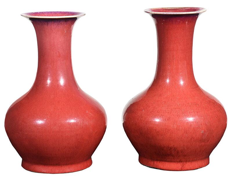 Near Pair Chinese Sang de Boeuf Vases: Qing dynasty, porcelain baluster form vases in oxblood red glaze, largest 14-5/8 in. - Provenance: Private Collection