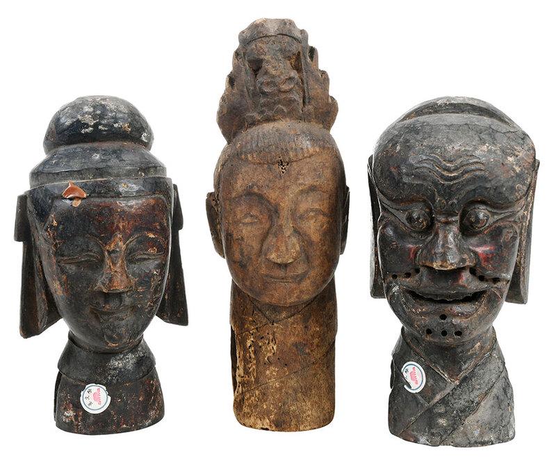 Three Asian Carved Wood Puppet Heads: probably Chinese, 19th/early 20th century, all three with hollowed necks to connect to puppet bodies and openings to back of heads, one with traces of red pigment, holes under mouth and cheeks, paper 