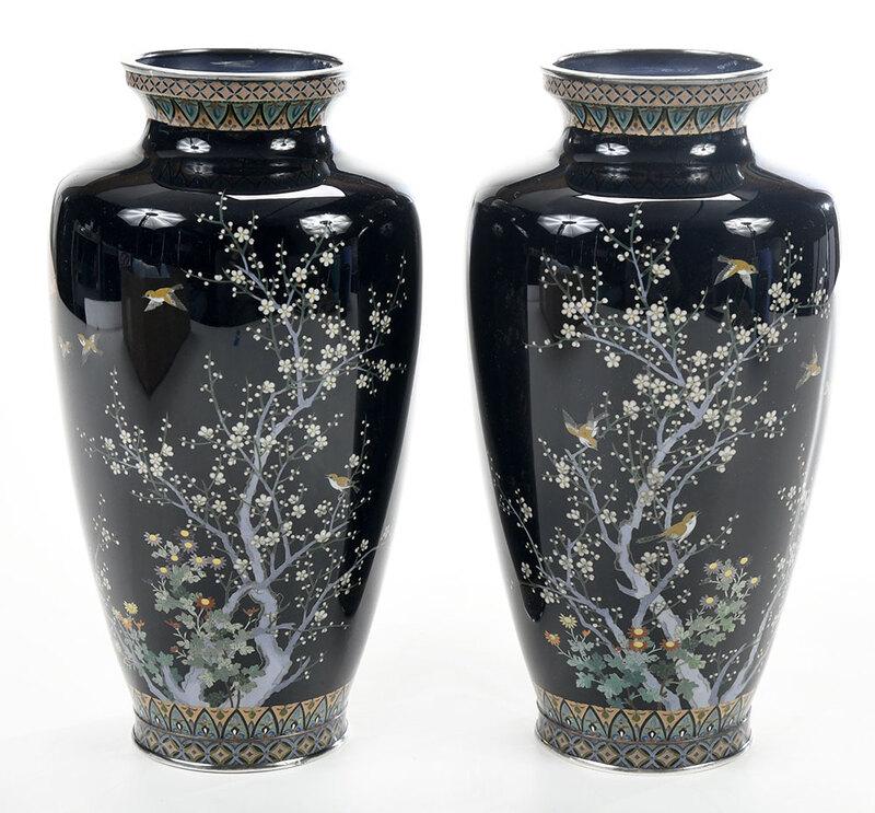 Pair of Japanese Cloisonn? Vases: probably Meiji period, pair elongated oviform vases with short waisted necks, decorated with branches of delicate flowers and perched birds on black ground, geometric borders at base and neck, one vas