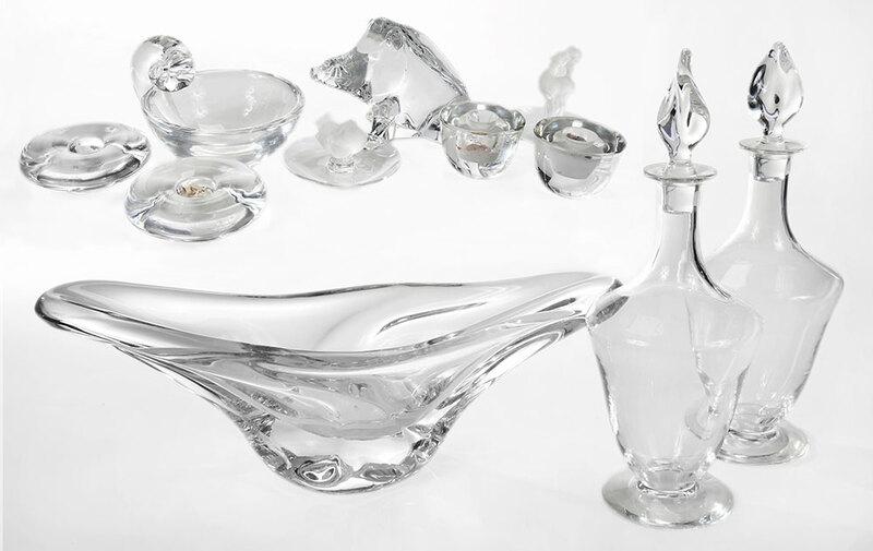 Eleven Pieces Clear Crystal, Daum and Baccarat: 20th century, three pieces signed "Daum France" including an elongated free form bowl. 6 x 17 in.; pair of decanters with stoppers, 12 in.; Baccarat pig figurine, 4 in.; pair of flat round candle hold