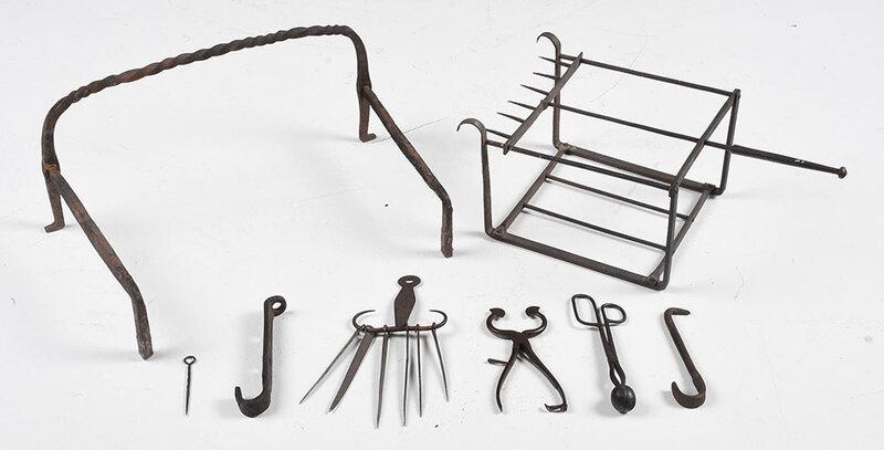 Group of Cast Iron Fireplace Tools: probably American, 19th century, set of skewers on hanger; two hanging pot holders; two toasting stands; pair of nippers and tongs, largest 21 in. - Provenance: Property from the Collection of Dudley 