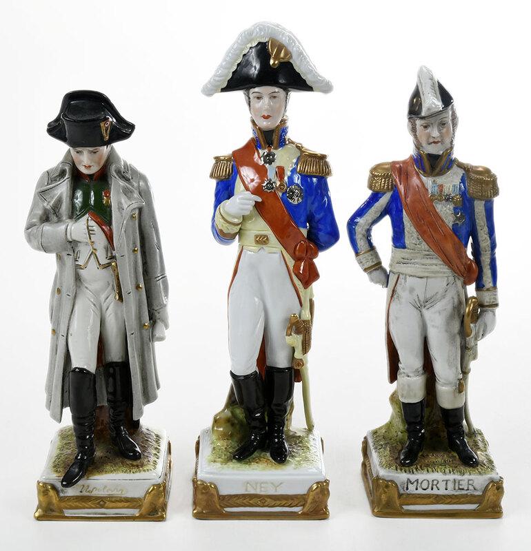 Three Hand Painted Porcelain Napoleonic Figures: German, 20th century, figure of˜Napoleon Bonaparte, Scheibe-Alsbach mark, 9 in.; figure of Michel Ney, Scheibe-Alsbach mark, 10-1/2 in.; figure of douard Mortier, Sandizell mark, 9-3/4 in. - Provenan