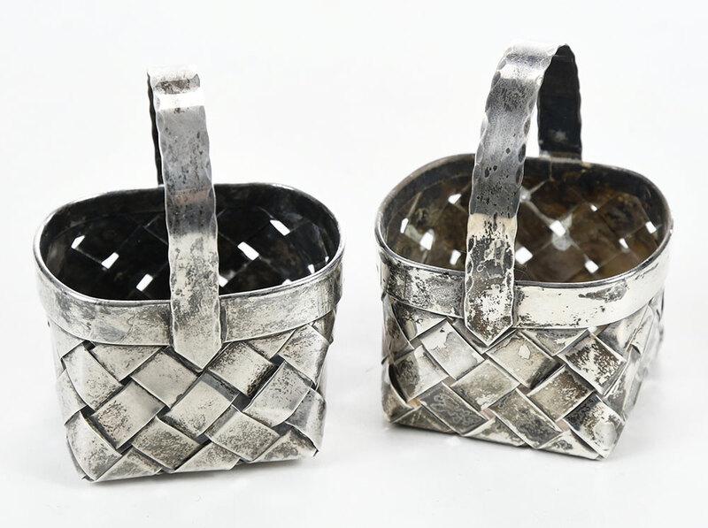Two Cartier Sterling Baskets: 20th century, woven silver basket form, marked "Cartier", "Handmade" and "Sterling", 98 grams, each 3 x 2-1/4 x 2 in. - Provenance: Private Collection