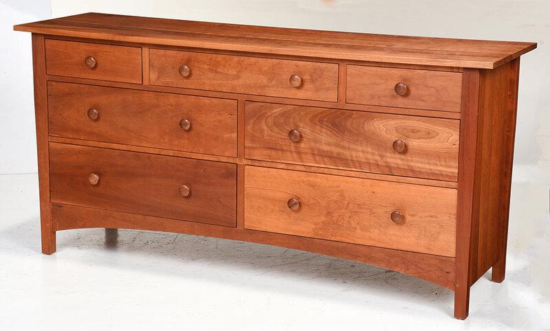 Contemporary Stickley Cherry Dresser: branded mark and metal tag for Stickley, with figured cherry throughout, seven drawers, one with felt lined jewelry side, 34 x 70-3/4 x 20 in. - Provenance: Private Collection, Asheville, North Caroli