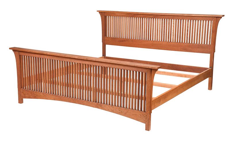 Contemporary Stickley King Size Bedstead: early 21st century, Prairie style, cherry throughout with spindle decorated head and footboard, Stickley branded mark and metal tag,˜45-1/4 x 87 x 86˜in. - Provenance: Private Collection, Asheville,