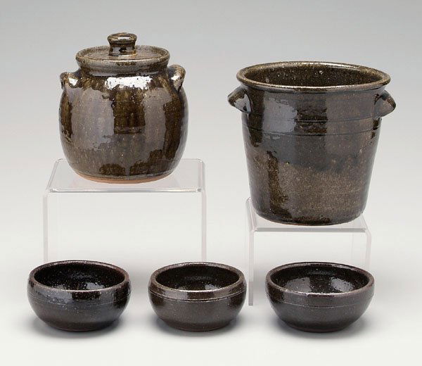 Five pieces Lanier Meaders pottery: (1917-1998, White County, Georgia), stoneware with olive alkaline glaze: covered beanpot, 7-1/2 in.; three bowls, 4-3/4 in. to 5-1/4 in., incised on bases "Lanier Meaders"; crock with two applied lugs
