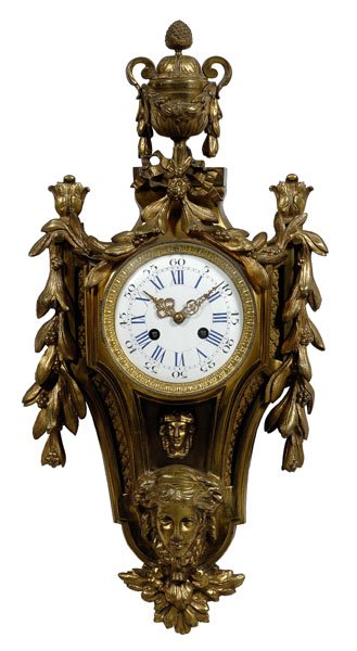 Louis XV style bronze dore clock,: urn finial above descending bellflowers with female bust, drop finial, enameled face, brass works, key wind, pendulum window at base, with key and matching pendulum with female bust, casting marks pos