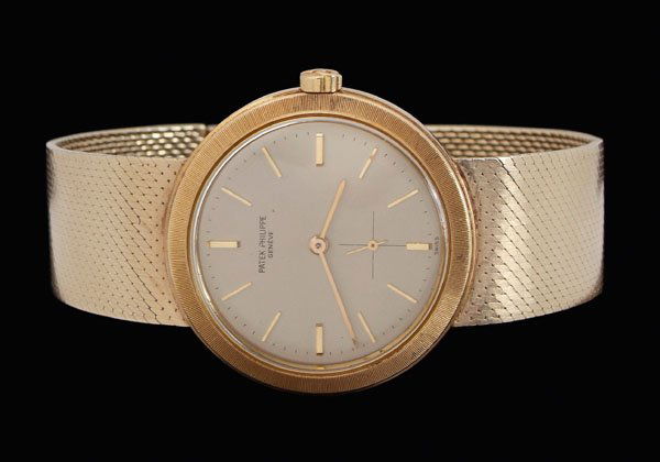 Patek Philippe wristwatch,: 18 kt. yellow gold watch, 1-3/8 in. round case with white satin face, 27 jewel movement, marked "Patek, Philippe & Co. Geneve, case "2629740/3473", textured mesh band, 7-1/4 in.; accompanied by "Extra