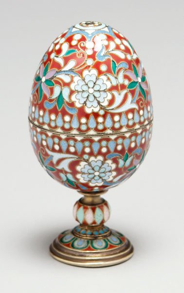 Pair Russian silver egg cups:: joined to form egg, floral enamel decoration, assayer mark possibly Ivan Ado, maker "MO", .875 fine, 3.99 oz.T., each cup 2-1/4 in., combined 3-3/4 in., [good condition, minor chips to enamel.]