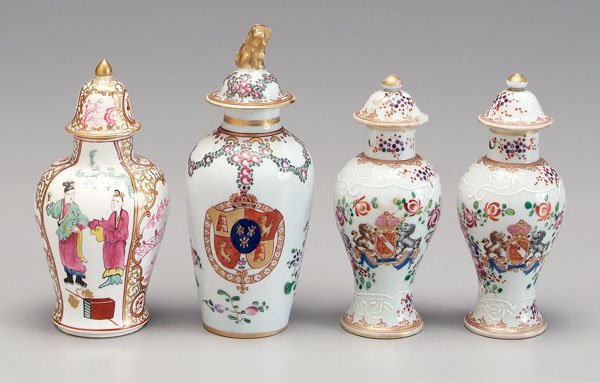 Four porcelain tea caddies:: one conical, gilt Buddhist lion finial, coat of arms with rampant lions and castles, 6-1/2 in., [minor rim chip to lid;] pair baluster, coat of arms for Howard, Duke of Norfolk, 5-1/2 in., [one lid re