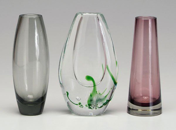 Three modern glass vases: Vicke Lindstrand aquatic vase, intaglio etched fish, internal seaweed decoration, 9-1/4 in.; Holmegaard, ovoid with smoky glass, 8-7/8 in.; Riihimaen Lasi Oy tapered amethyst vase, acid etched mark wi