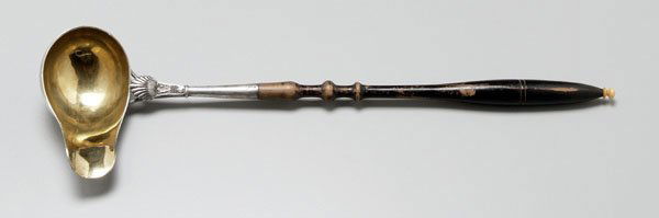 17th century German silver ladle,: gilt helmet form bowl, applied shell decoration, turned wooden handle with bone tip, marks possibly for Elberfeld, Germany, 1657, no monogram, 15-1/2 in. Wear to handle.