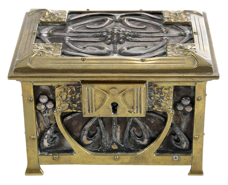 European Art Nouveau Jewelry Box: 20th century, rectangular form with silvered metal openwork sides and brass mounts, stylized tree decoration, hinged lid opening to green fabric lined interior, 3-3/8 x 5 in. - Provenance: Property fr