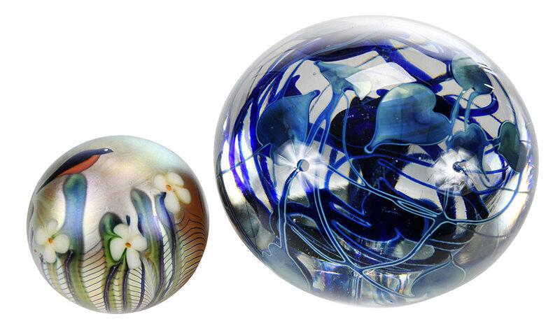 Charles Lotton, Orient & Flume Glass Paperweights: American, 20th century, magnum art glass paperweight, blue vine and leaf motif, signed "Charles Lotton 1974 #92", 4 x 5-1/2 in.; iridescent art glass paperweight, bird and flower decoration, signed "O