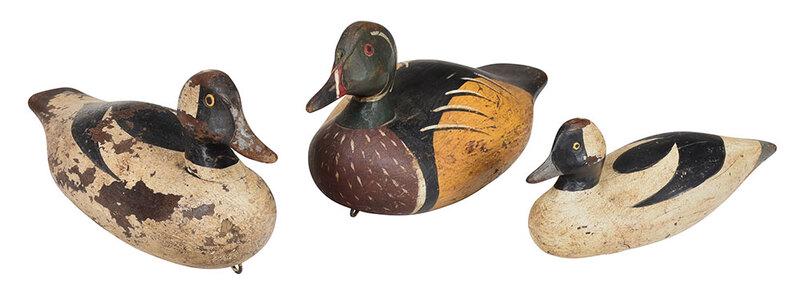 Three John Paxson Carved and Painted Duck Decoys: Virginia, 20th century, including two buffleheads, 10 in. and 8 in.; wood duck, 10 in., all with carved and painted eyes, carved conjoined "JP" on underside - Provenance: Private Collection, North Car