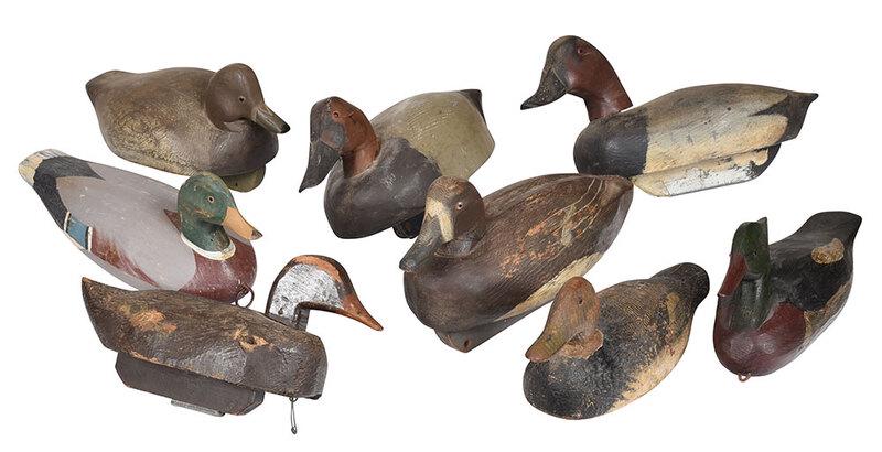 Eight Carved and Painted Working Duck Decoys: American, 20th century, including merganser, signed "RLW"; mallard drake, signed "Ron Vick/#267"; six others, most with weights and glass eyes, 14 in. to 17 in. - Provenance: Private Collection, Atl