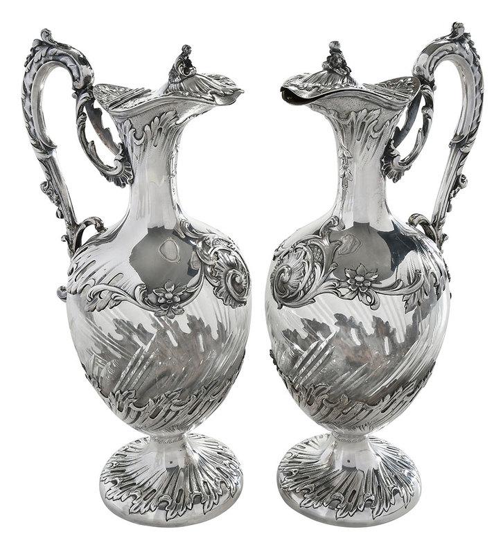 Pair of French Silver and Glass Ewers: Paris, late 19th century, scroll and wave decoration, cut glass body, marks for Louis Coignet (1889-1893), .950 fine, 12-1/2 in. - Provenance: Private Florida Collection