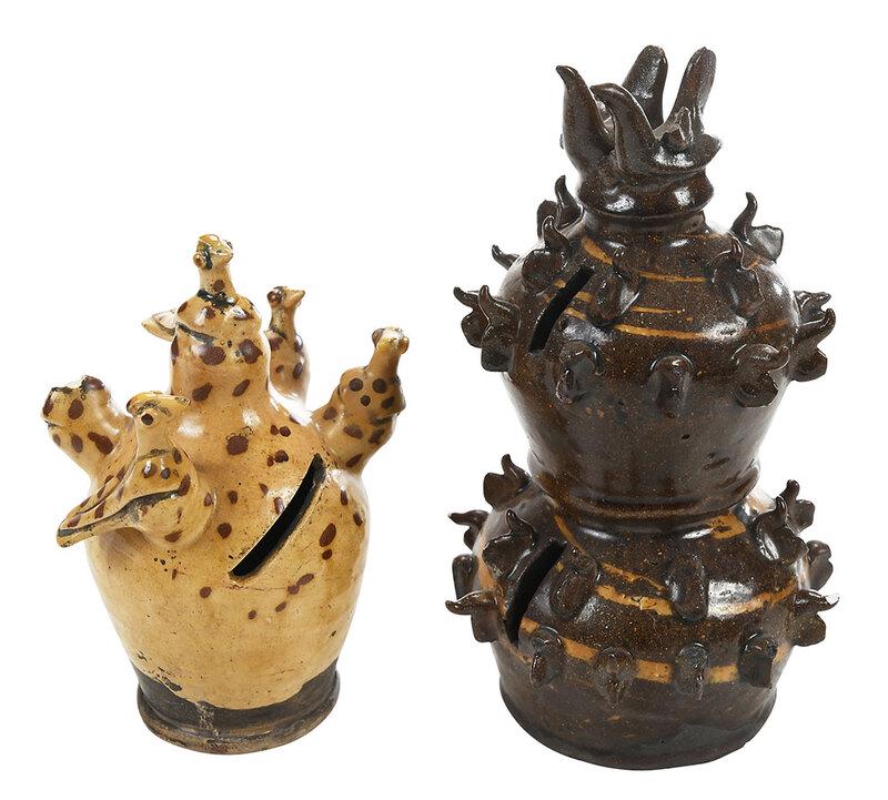 Two English Slipware Bird Decorated Money Boxes: probably Yorkshire area, early to mid 19th century, yellow and brown spotted slipware bank with applied bird figures, 7 in.; double bodied brown glazed bank, with overall applied bird figures, 8-3/4 i