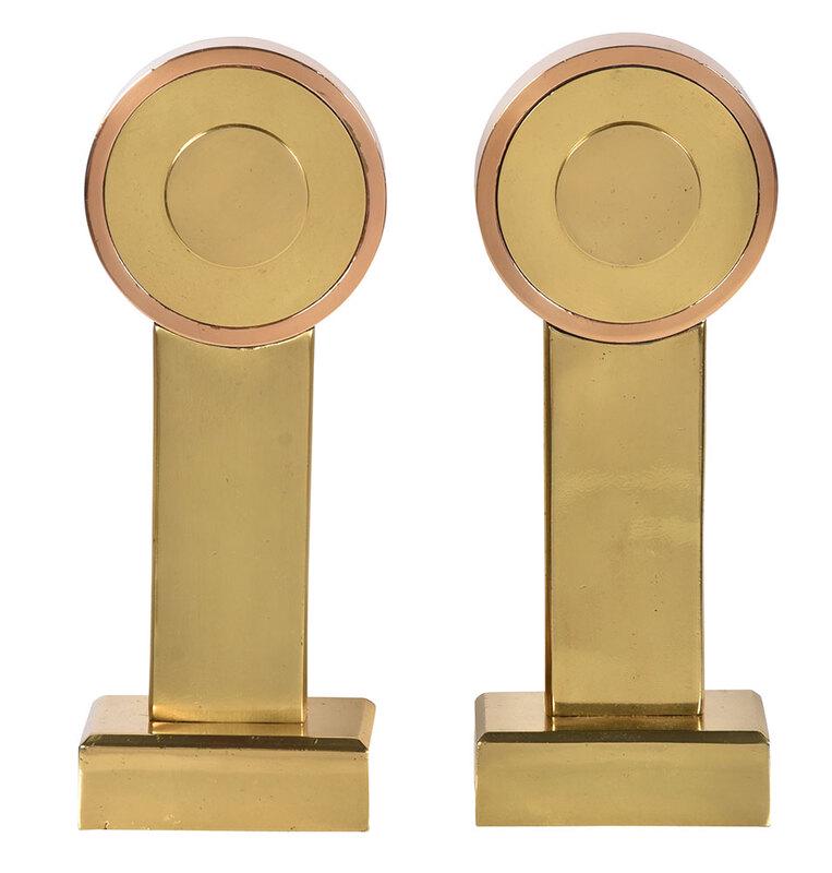 Pair of Art Deco Brass Andirons: probably American, circa 1930s, two tone brass round finials on rectangular base, 15 in.[Art Deco] - Provenance: Carlton Dailey, Charleston, South Carolina, (lot accompanied by sales listing indicatin