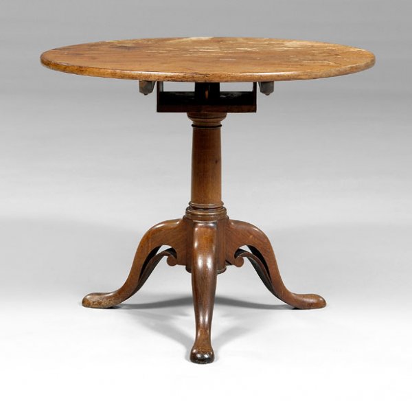 Queen Anne tilt-top tea table,: single-board figured mahogany top tilting over a box-form birdcage column support and tripod base with pierced cabriole legs and pad feet, probably British, 18th century, 27-3/4 x 33-1/2 x 33 in. Some
