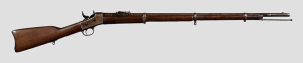 Model 1870 U.S. rifle,: 50 cal. rolling block, 33-3/4 in. barrel with indistinct marks, otherwise unmarked, probably a Remington, walnut stock. Metal parts with old brown speckled patination, possibly restocked and/or refini