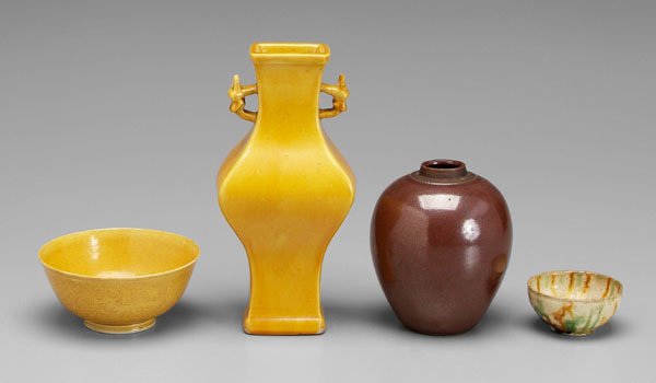 Four pieces Chinese porcelain,: pottery: yellow-glazed square section vase, dragon head handles, 19th century, 8-1/4 in., [repair to one dragon head;] rust-glazed jar, old paper label "Ch'ien Lung…", 19th century, 4-3/4 in., [lack