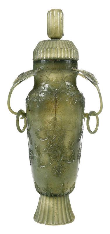 Mughal Style Carved Jade Chrysanthemum Vase: Qing dynasty, celadon jade baluster vase with fluted floriform cover, delicate handles in the form of leafy chrysanthemum sprays with rings, carved on each side with a bodhisattva playing a wind ins