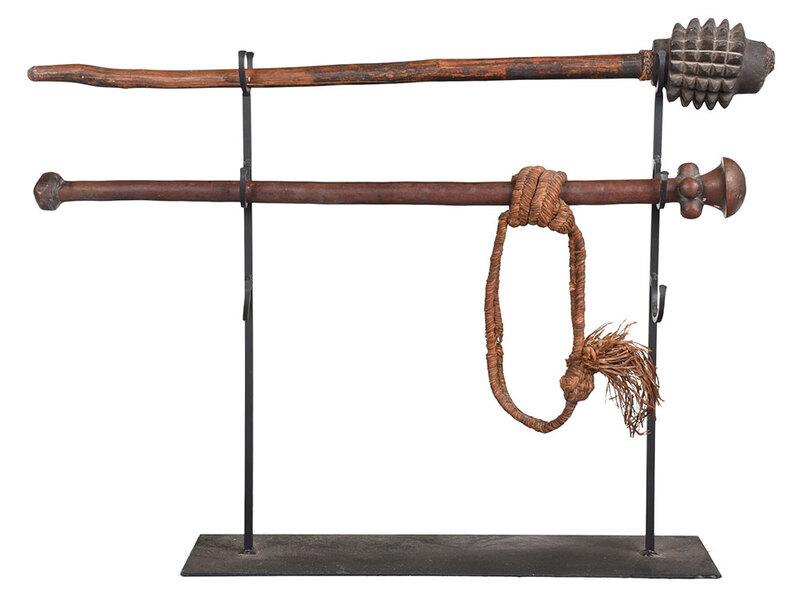 Two South Pacific Clubs: late 19th/early 20th century, Fiji Island carved wooden staff or club with composite pinecone head and braided fibers that wrap around the base of the pinecone, 34 in.; Vanuatu (New Hebrides) wood sha