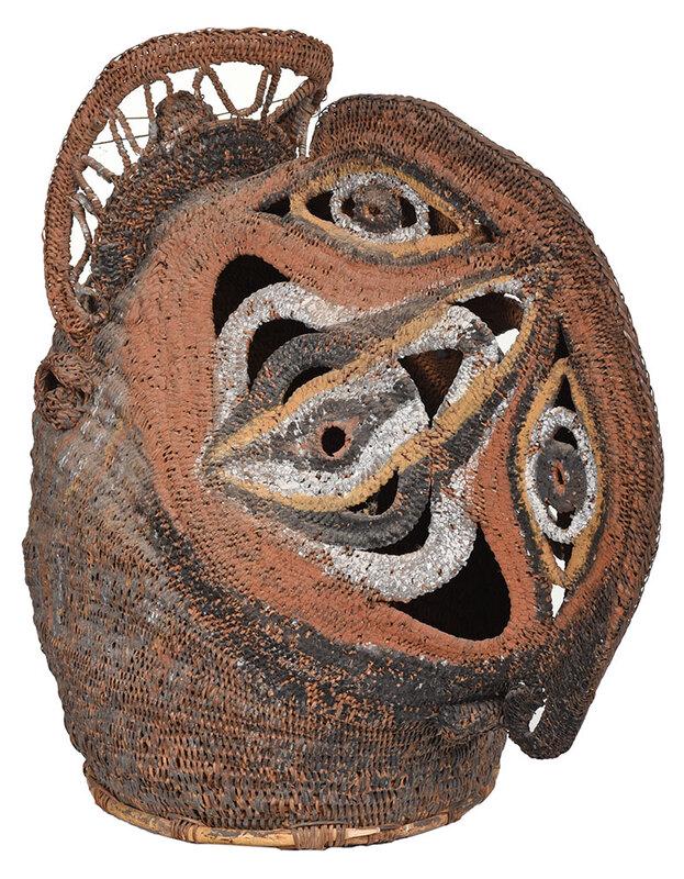 Papua New Guinea Abelam Woven Basketry Mask: 20th century, red/orange paint decorated woven mask with complex designs on sides, 20 x 21 in., with round white pedestal - Provenance: Private Collection, Tryon, North Carolina