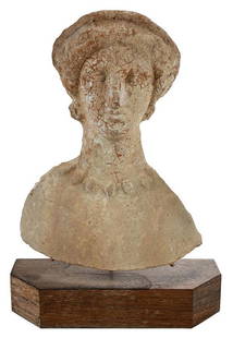 A Cypriot Terracotta Bust of a Woman: 1st century B.C., figure wearing earrings and possibly a stephane, in relief, 10 x 8 x 2-3/4 in., with wire and wood base, 2 x 9-1/8 x 3-1/4 in. Note: This lot will be accompanied by a letter from