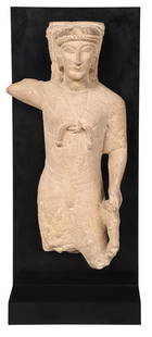 An Important Cypriot Limestone Figure of Herakles: early 6th century B.C., figure with arm raised with what would have been a club in hand, lion at proper left hand, wearing a lion skin, knotted at chest, draping over shoulders and lion's head enclosi