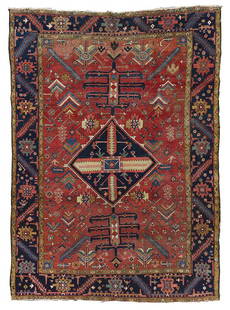 Heriz Carpet: early 20th century, blue diamond shaped central medallion, red field with leaf and floral design, dark blue border, 11 ft. 9 in. x 8 ft. 6 in. - Provenance: Private Collection, Connecticut