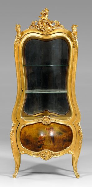 Venetian rococo style vitrine,: [rocaille] carved crest flanked by carved busts of ladies, vitrine interior with mirrored back and bottom, bottom of door with oil on panel courting scene, 20th century construction, 70-3/4 x 31 x 16-