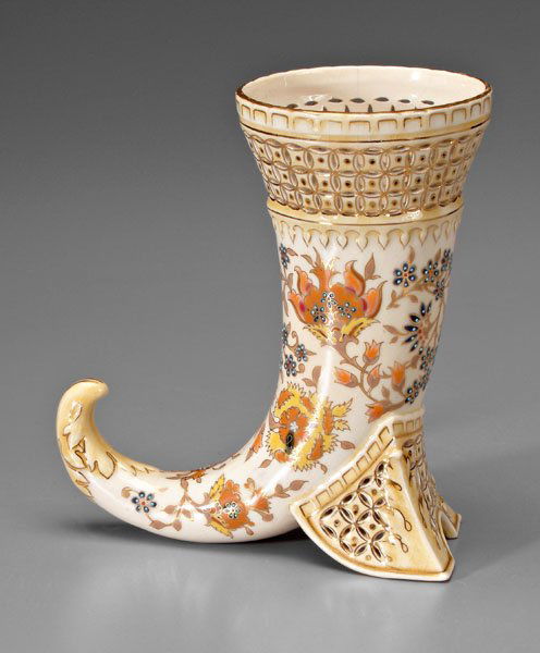Zsolnay cornucopia vase,: enameled floral decoration with gilt highlights and reticulated borders, blue printed five-castle mark under glaze for Zsolnay Pecs, 20th century, 8-3/4 in. One 5/8 in. rim crack, overall light crazin