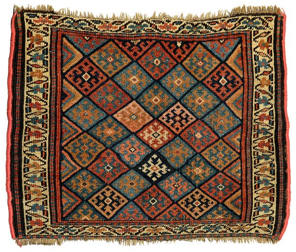 Caucasian mat,: diagonal rows of diamonds with hooked elements, 2 ft. 5 in. x 1 ft. 10 in. Generally even low pile, end loss up to 1/2 in., lacking fringe with later binding.